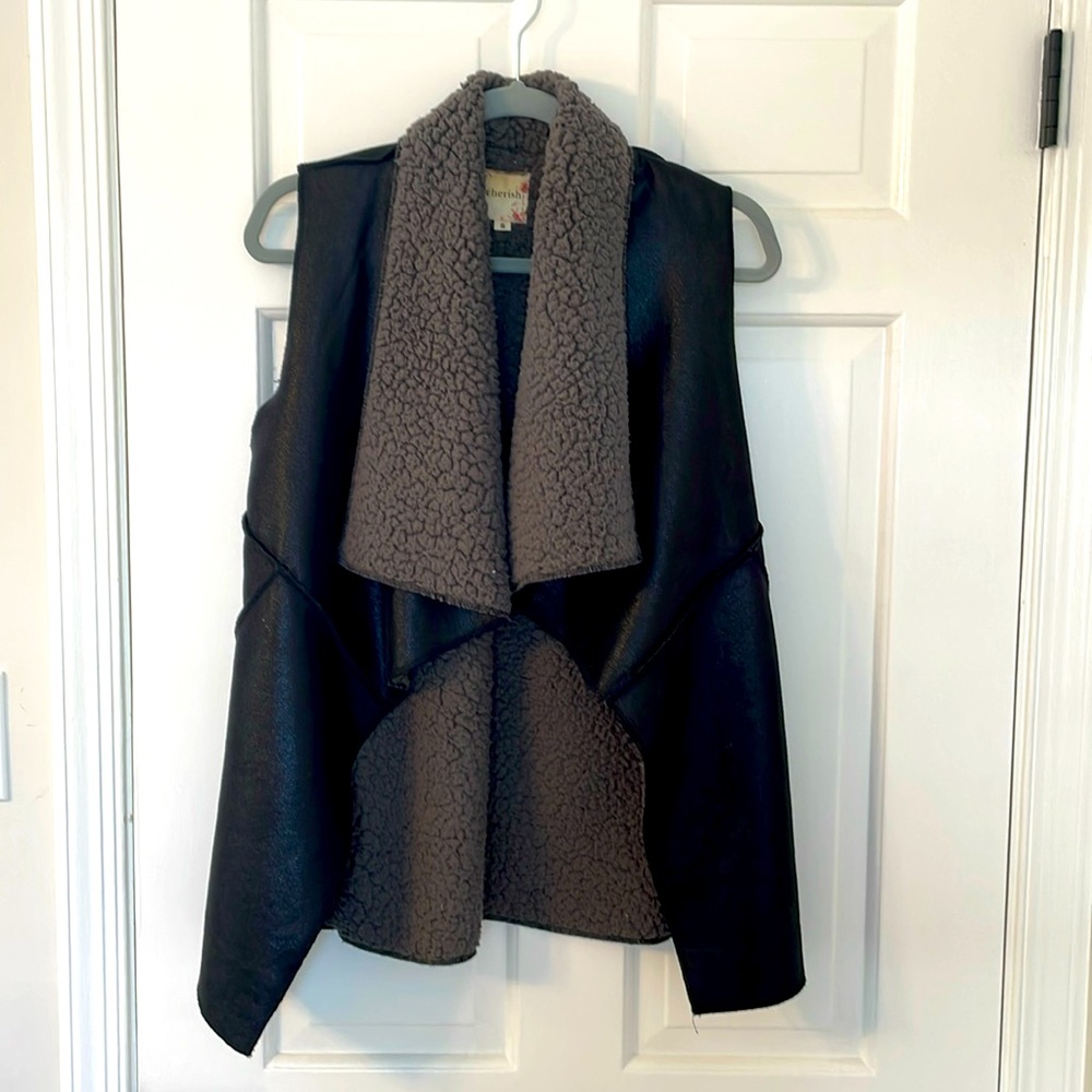 Beautiful black vegan leather vest, lined warm cozy sherpa material.
